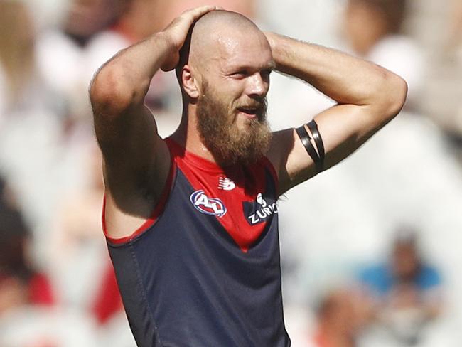 Max Gawn of the Demons and Scott Lycett of the Power exchange words during the Round 1 AFL match between the Melbourne Demons and the Port Adelaide Power at the MCG in Melbourne, Saturday, March 23, 2019. (AAP Image/Daniel Pockett) NO ARCHIVING, EDITORIAL USE ONLY