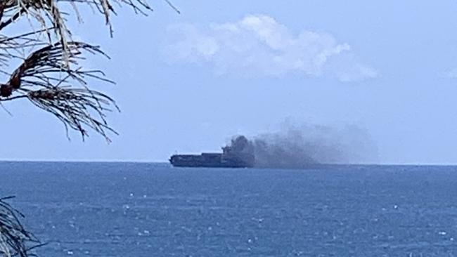 A dramatic picture shows smoke from a cargo ship after it had mechanical difficulty off Moffat Beach on October 12. Picture: Contributed