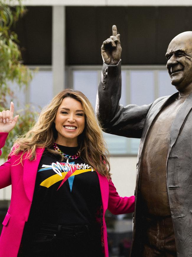 Her sister, Dannii, posed alongside a statue of the music legend beforehand. Picture: Mushroom Creative House