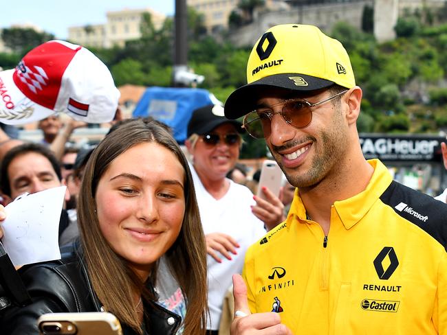 MONTE-CARLO, MONACO - MAY 24: Daniel Ricciardo of Australia and Renault Sport F1 poses for a photo with a fan during previews ahead of the F1 Grand Prix of Monaco at Circuit de Monaco on May 24, 2019 in Monte-Carlo, Monaco. (Photo by Michael Regan/Getty Images)