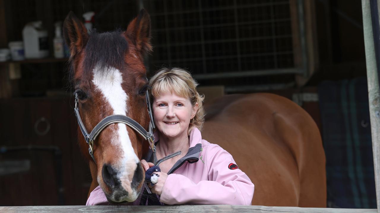 Michelle Le Grew, who pays $90,000 a year for cancer treatment not on the PBS, with her horse Max. Picture: Andrew Tauber