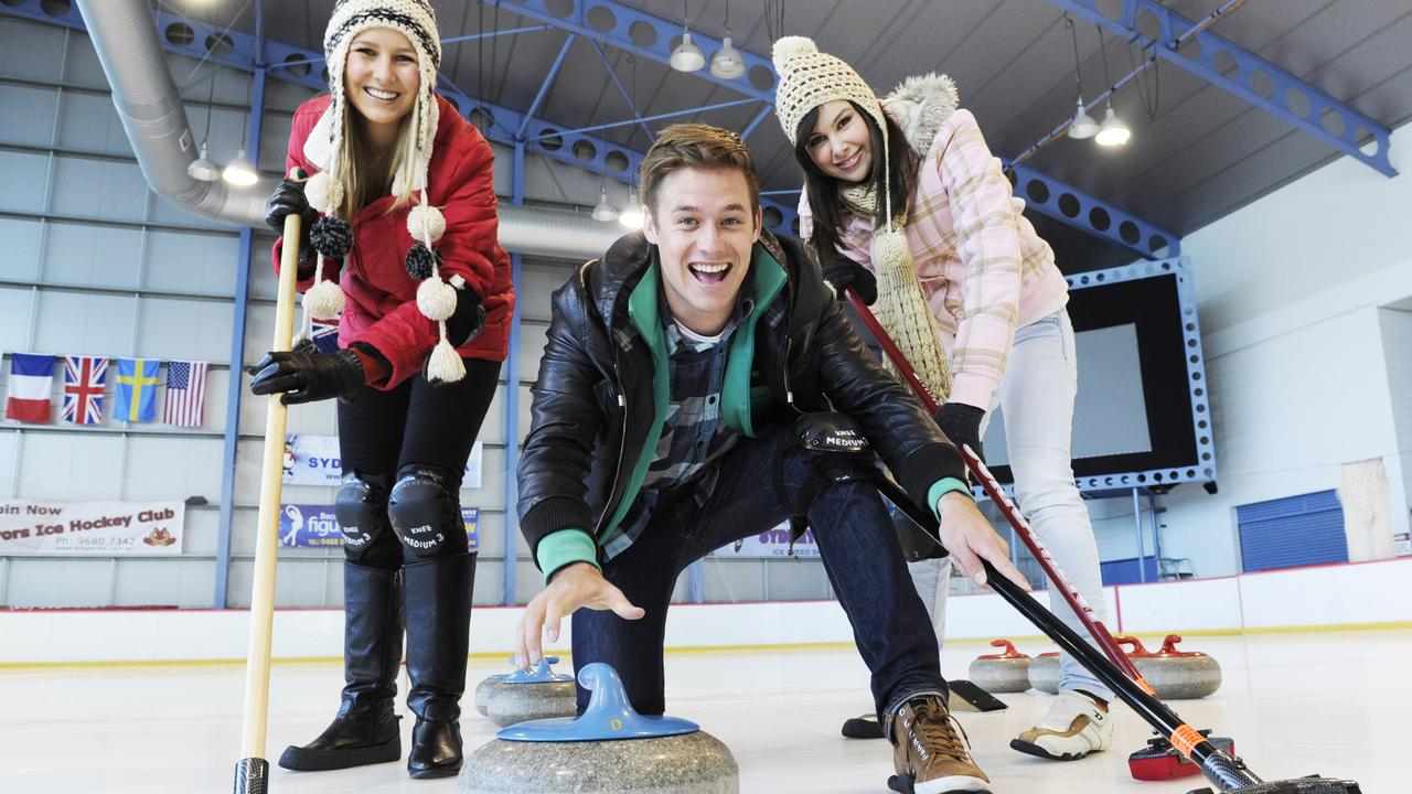 Saturday Disney hosts Candice Dixon, Nathan Morgan and Shae Brewster practice their skills at Curling while filming on location at Sydney Ice Arena in Baulkham Hills.