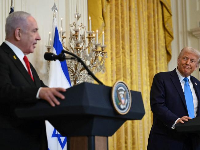 US President Donald Trump listens to Israel's Prime Minister Benjamin Netanyahu during a press conference in the East Room of the White House in Washington, DC, on February 4, 2025. Netanyahu met Trump at the White House Tuesday for crucial talks on the truce with Hamas, as the US president suggested permanently resettling Palestinians from war-battered Gaza. (Photo by ANDREW CABALLERO-REYNOLDS / AFP)