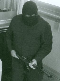 Parsons during one of the robberies, with his signature SKK 7.62 rifle. Picture: Supplied