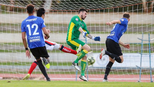 Substitute Andreas Wiens scores one of his two goals for Adelaide Comets against South Adelaide. Picture: Adam Butler