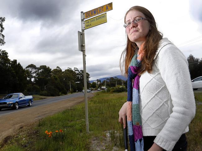 Legally blind uni student nichola McKillop is forced to cross the busy Channel Hwy and catch the bus into town from Margate since the State Government took away her taxi allowance.