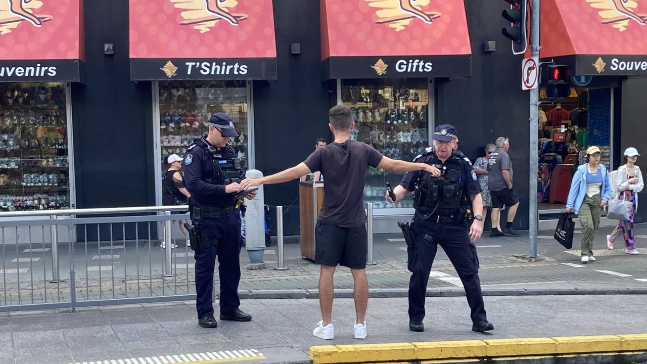 Police wanding in Surfers Paradise.