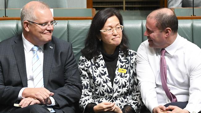 Prime Minister Scott Morrison and treasurer Josh Frydenberg next to Liberal member for Chisholm Gladys Liu. Picture: AAP Image/Lukas Coch