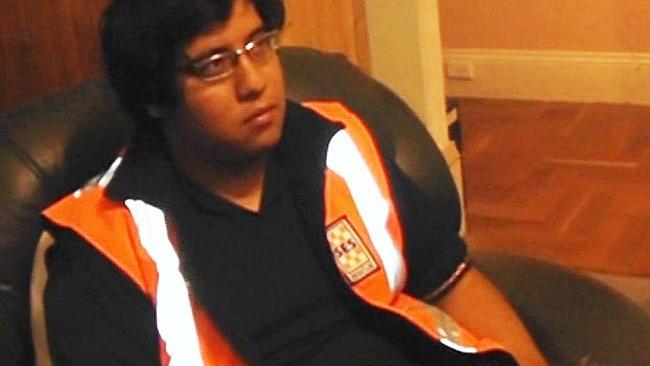 SES volunteer Jose Omonte-Extrada is questioned by detectives in his Quorn sitting room.