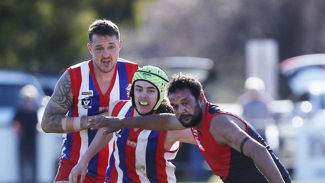 Swifts Creek’s Nathan Hayes and Lindenow South’s Griffin Sherritt battle for the ball. Picture: Yuri Kouzmin