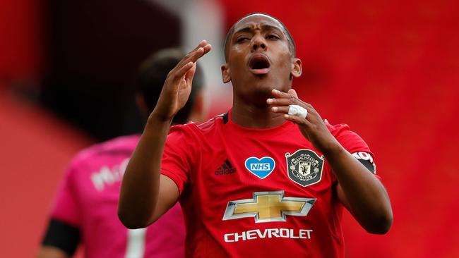 Manchester United's French striker Anthony Martial reacts after missing a chance during the English Premier League football match between Manchester United and Southampton at Old Trafford in Manchester, north-west England, on July 13, 2020. (Photo by Clive Brunskill / POOL / AFP) / RESTRICTED TO EDITORIAL USE. No use with unauthorized audio, video, data, fixture lists, club/league logos or 'live' services. Online in-match use limited to 120 images. An additional 40 images may be used in extra time. No video emulation. Social media in-match use limited to 120 images. An additional 40 images may be used in extra time. No use in betting publications, games or single club/league/player publications. /