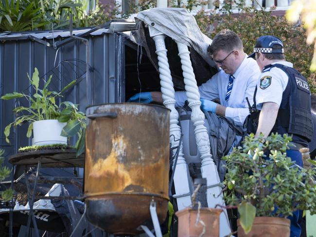 Police search for evidence on Friday at a house in Drummoyne where a woman was murdered. Picture: Tom Parrish