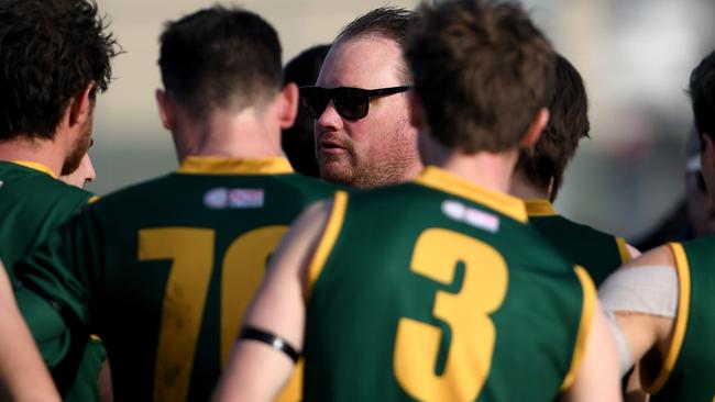 Old Eltham Collegians coach John Garrad talks to his players. Picture: Andy Brownbill