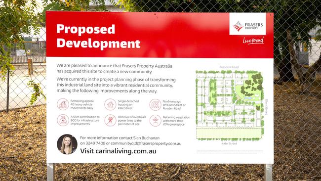 Development signs for the Goodman Fielder site at Fursden Road, Ellen Street and Kate Street in Carina, go up last month. Picture: AAP/Richard Walker