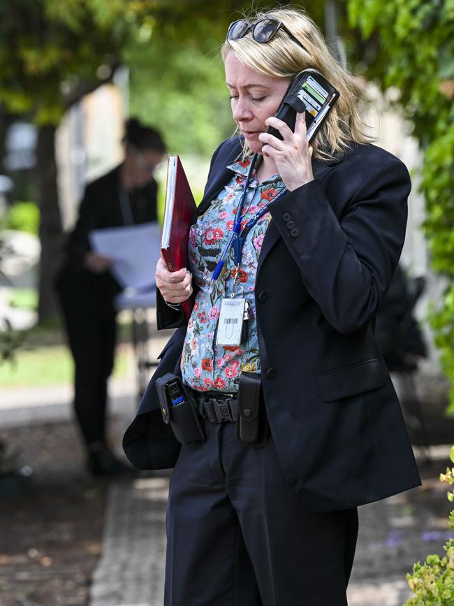 A detective outside Dr Michael Yung’s Gilberton home on Tuesday. Picture: Mark Brake