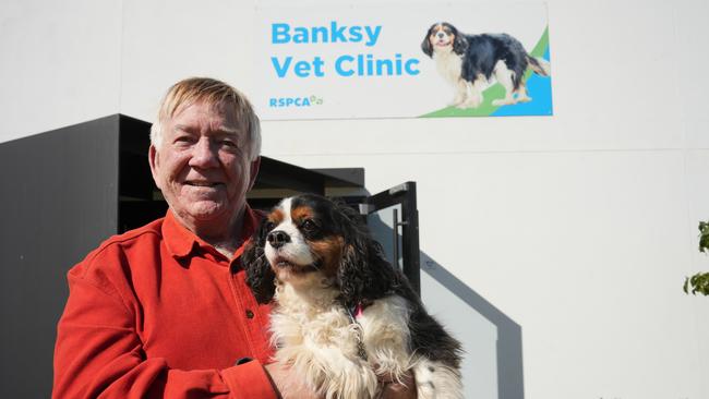 Philanthropist and RSPCA donor Rodney Banks with his dog Cindy outside the $1.3m Banksy Vet Clinic at RSPCA Wellcamp, which was delivered thanks largely to his financial contributions.