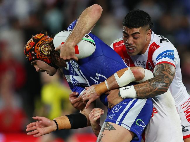 SYDNEY, AUSTRALIA – AUGUST 10: Hame Sele of the Dragons tackles Josh Curran of the Bulldogs during the round 23 NRL match between St George Illawarra Dragons and Canterbury Bulldogs at Netstrata Jubilee Stadium, on August 10, 2024, in Sydney, Australia. (Photo by Jeremy Ng/Getty Images)