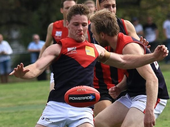 Tim Jones throws the ball on his boot. Picture: Davis Harrigan