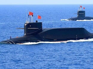 Chinese nuclear-powered missile and attack submarines parade for Chairman Xi Jinping. Picture: PLAN