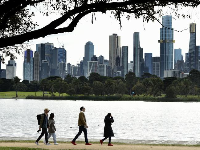 MELBOURNE, AUSTRALIA - NewsWire Photos June 02, 2022: A group walk around Albert Park Lake with the Melbourne skyline in the background on a day when the city temperature is not expected to go above 12'. Picture: NCA NewsWire / Andrew Henshaw