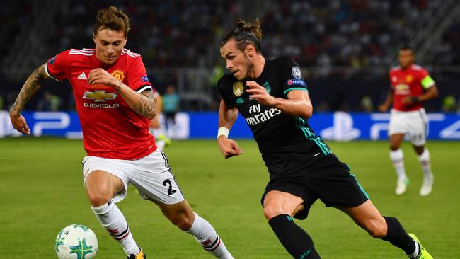 Gareth Bale of Real Madrid attempts to get past Victor Lindelof.