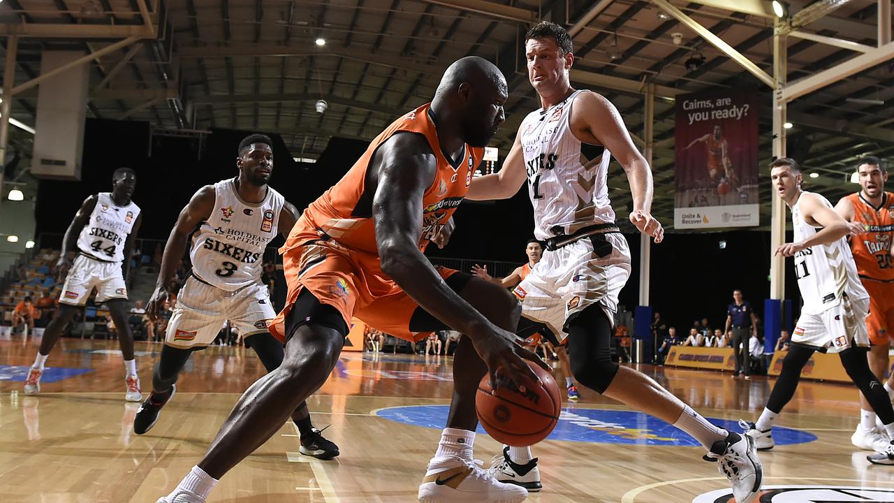 CAIRNS, AUSTRALIA – MARCH 28: Nathan Jawai of the Taipans handles the ball under pressure during the round 11 NBL match between the Cairns Taipans and the Adelaide 36ers at Cairns Pop Up Arena on March 28, 2021 in Cairns, Australia. (Photo by Albert Perez/Getty Images)