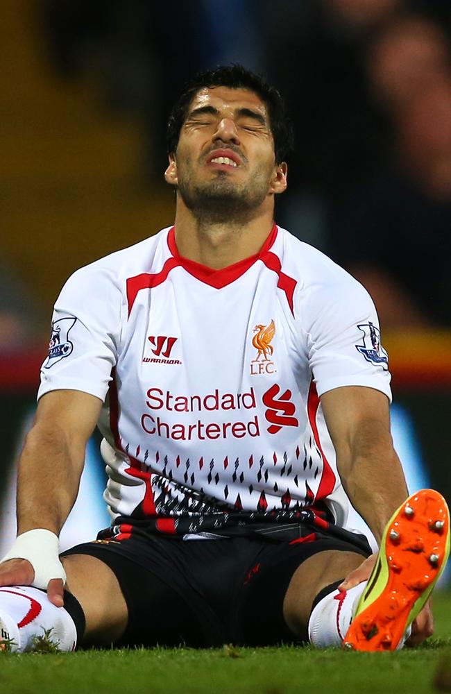 The jersey isn’t hiding his face yet here, but Suarez is already breaking down.