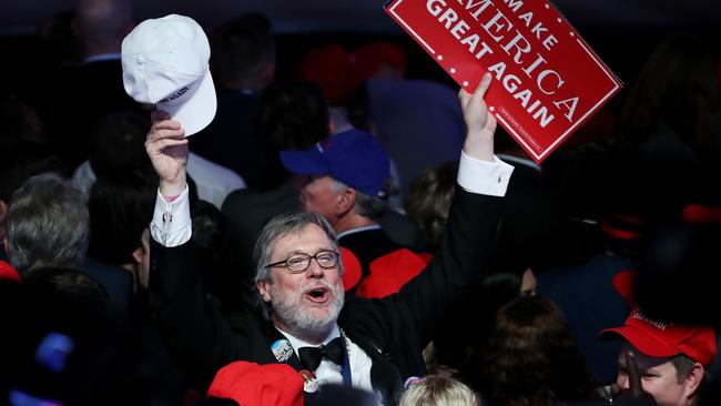 Donald Trump supporters celebrate in New York yesterday.