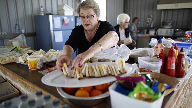 Community volunteers including Heather Miller (above) prepared food for the search teams at Kendall showground. Picture: David Moir