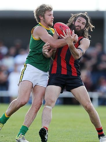 Gippsland Football League Grand Final match between Maffra Eagles and Leongatha Parrots. Maffra became the 2016 premiers, defeating Leongatha 13.10 (88) to 9. 16 (67).,Daniel Bedggood and Jason Tomada battle it out for the ball. Picture: Yuri Kouzmin