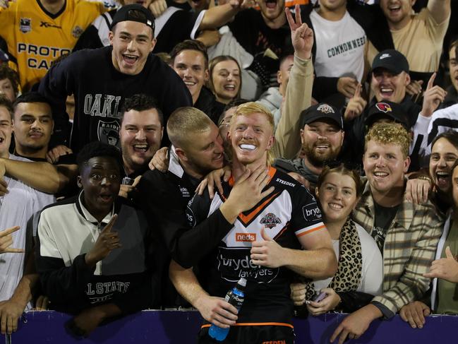 Zac Cini of the Tigers with his fans.