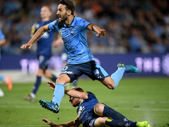 Sydney FC’s Milos Ninkovic rides the challenge of the Mariners’ Ziggy Gordon. Picture: AAP