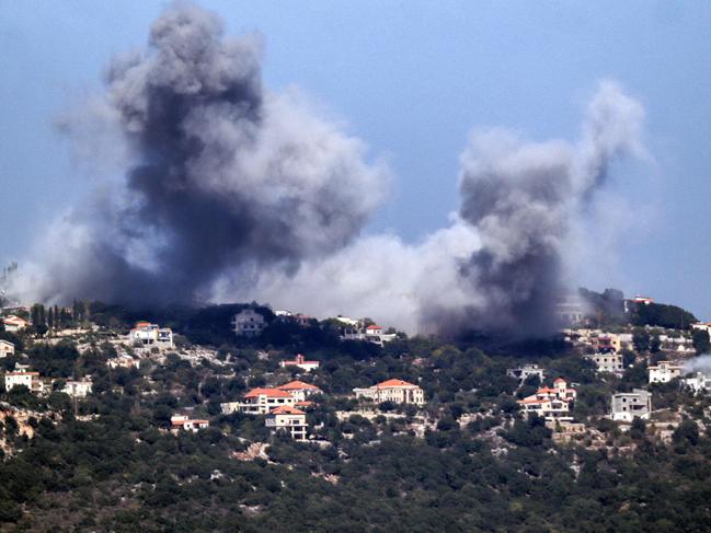 A cloud of smoke erupts during an Israeli air strike on the village of Sujud in southern Lebanon on September 25, 2024. Picture: AFP