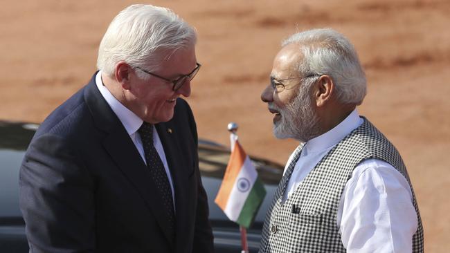 German President Frank Walter Steinmeier is welcomed to New Delhi by Narendra Modi on Saturday. Picture: AP