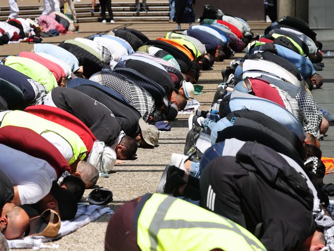 Protesters pray during a pro-Palestinian in the CBD. Picture: David Swift