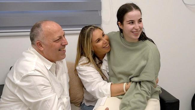 Agam Berger is reunited with her parents after her release by Hamas. Picture; Israeli Army/AFP.