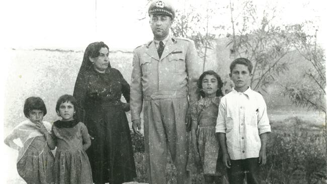 Farida Ayubi, second from left, with her parents and siblings.