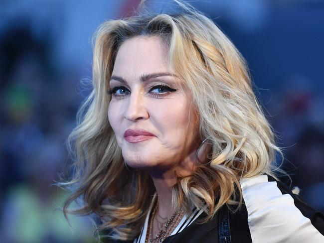 US singer-songwriter Madonna poses arriving on the carpet to attend a special screening of the film "The Beatles Eight Days A Week: The Touring Years" in London on September 15, 2016. / AFP PHOTO / Ben STANSALL