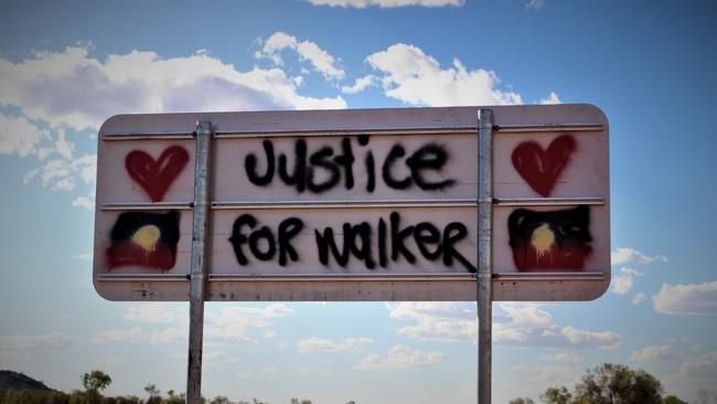 Signs on the Tanami Road to Yuendumu. Kumanjayi Walker. Zach Rolfe. Police shooting. Justice. Picture: Jason Walls