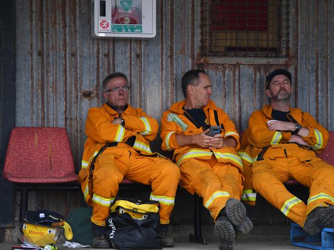 Fire fighters are seen at Kingscote oval after fighting fires through the night on Kangaroo Island, Friday, January 10, 2020. Picture: AAP/ David Mariuz