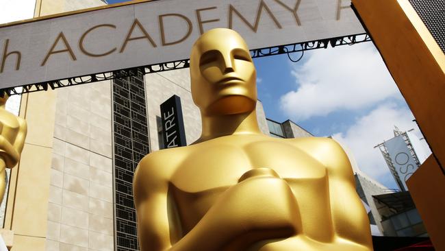 FILE - In this Feb. 21, 2015 file photo, an Oscar statue appears outside the Dolby Theatre for the 87th Academy Awards in Los Angeles. The largest black audience for the Academy Awards over the last dozen years came in 2005, when Chris Rock was host and Jamie Foxx and Morgan Freeman won the top male acting awards. Rock will be back as host this year, but it's an open question how many African American viewers will be tuning in. A lack of diversity in Oscar nominations have led to stars like Spike Lee and Jada Pinkett Smith calling for a boycott of the Academy Awards, scheduled for Feb. 28. (Photo by Matt Sayles/Invision/AP, File)