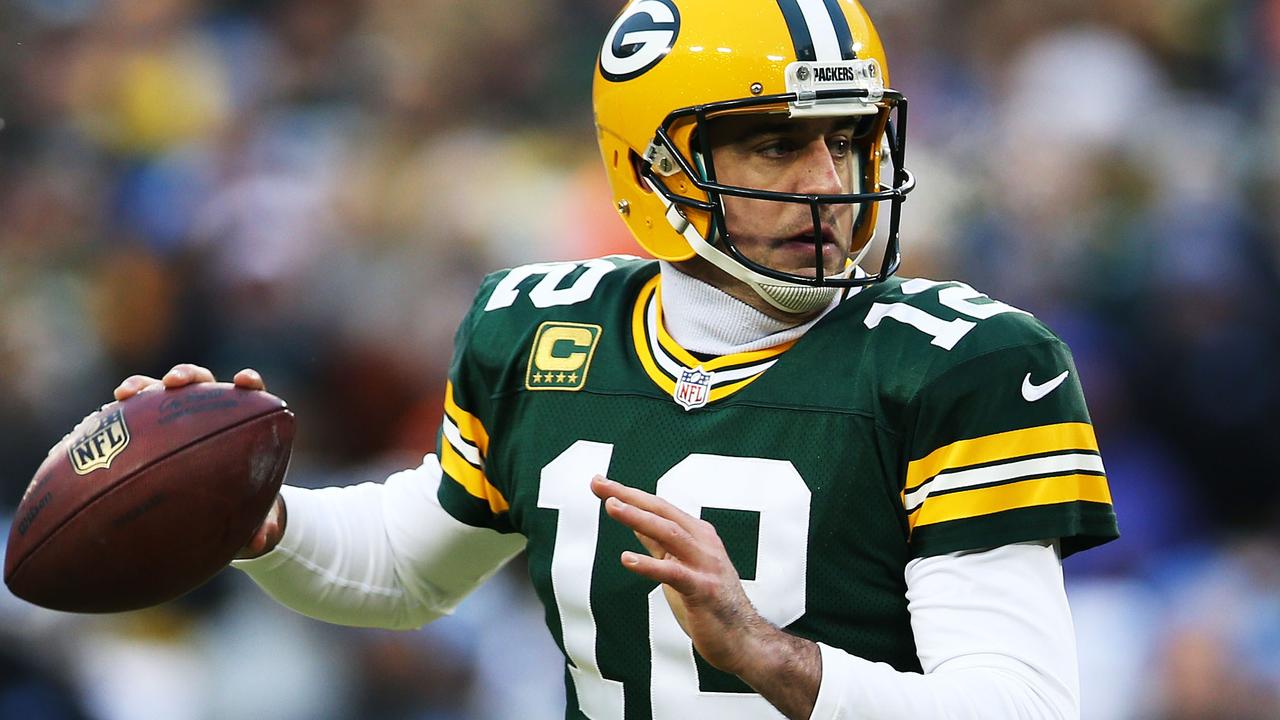 GREEN BAY, WI - DECEMBER 28: Aaron Rodgers #12 of the Green Bay Packers looks to pass against the Detroit Lions in the first quarter at Lambeau Field on December 28, 2014 in Green Bay, Wisconsin. Chris Graythen/Getty Images/AFP == FOR NEWSPAPERS, INTERNET, TELCOS & TELEVISION USE ONLY ==