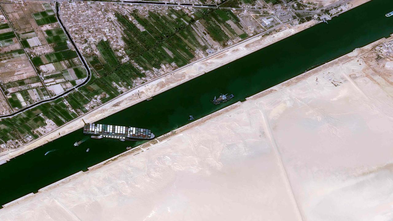 This satellite image shows the Taiwan-owned MV ‘Ever Given’ container ship lodged sideways and impeding all traffic across the waterway of Egypt’s Suez Canal. Picture: CNES/AFP