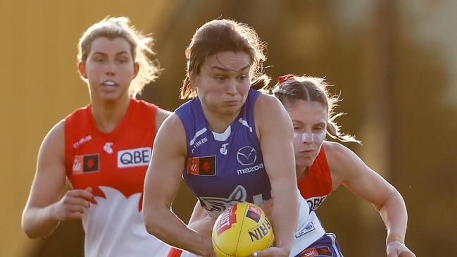 MELBOURNE, AUSTRALIA - OCTOBER 02: Ashleigh Riddell of the Kangaroos is tackled by Lisa Steane of the Swans during the 2022 S7 AFLW Round 06 match between the North Melbourne Kangaroos and the Sydney Swans at Swinburne Centre on October 2, 2022 in Melbourne, Australia. (Photo by Dylan Burns/AFL Photos via Getty Images)