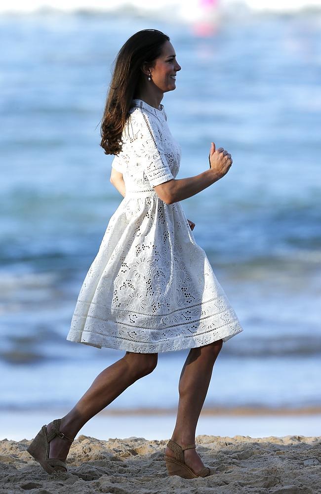 Baywatch moment ... Kate runs along Manly Beach during a visit to watch the nippers perform on the beach. Picture: Bradley Hunter