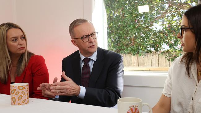 Anthony Albanese and his partner Jodie Haydon talk with Lydia Pulley, a renter struggling save to enter the housing market in Gosford, NSW. Picture: Liam Kidston