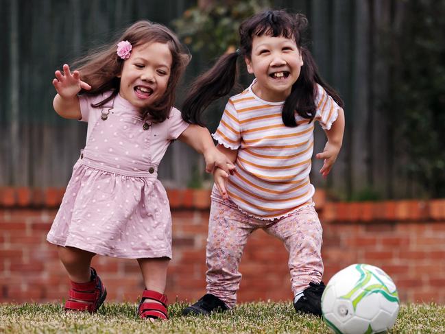 The sisters enjoy playing in the backyard of their Glenhaven home. Picture: Sam Ruttyn