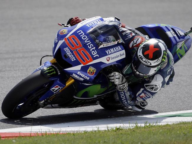 Yamaha's rider Jorge Lorenzo takes a curve on his way to clinch the third fastest time during the Italian MotoGP qualifying session, at the Mugello race circuit, in Scarperia, Italy, Saturday, May 30, 2015. (AP Photo/Gregorio Borgia)