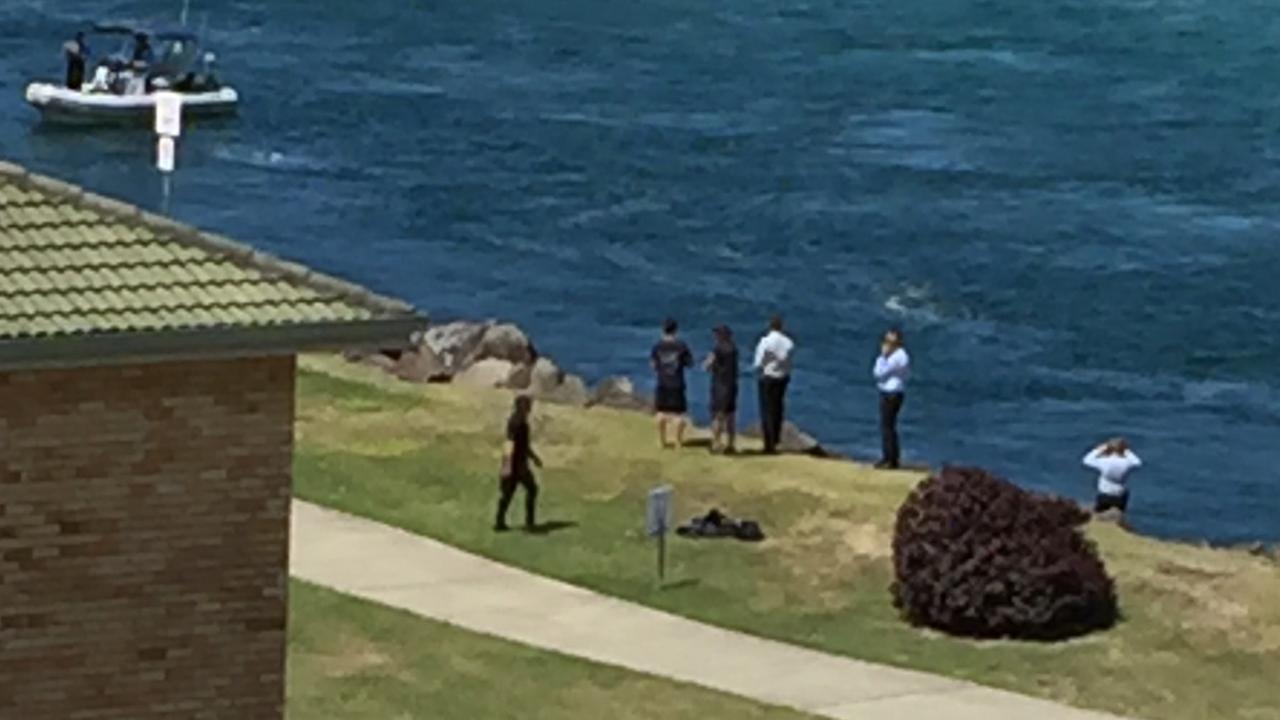 Locals told the Courier Mail they saw police throwing objects into the water. Picture: Greg Stolz