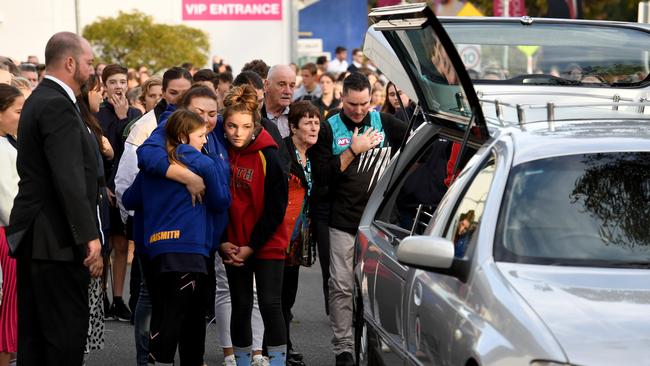 Sophia Naismith’s family gather and comfort each other outside Friday’s emotional funeral service. Photo: Tricia Watkinson